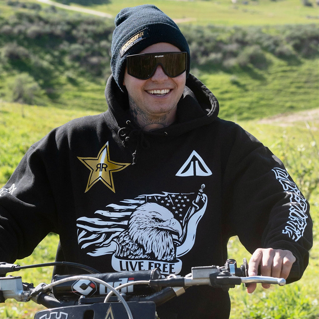 man wearing black sunglasses on a dirt bike - lifestyle