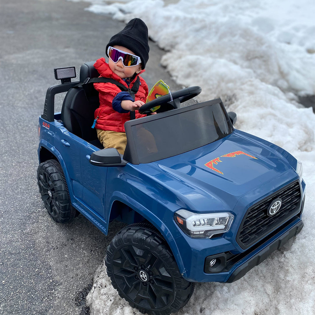 baby boy in a toy car wearing miami nights baby vipes - lifestyle