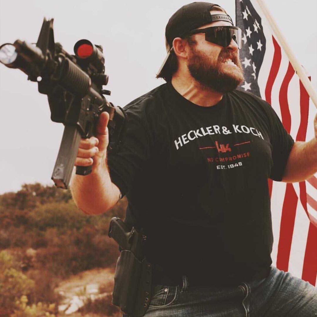 Man holding a gun wearing The Black Ops 2000s - lifestyle