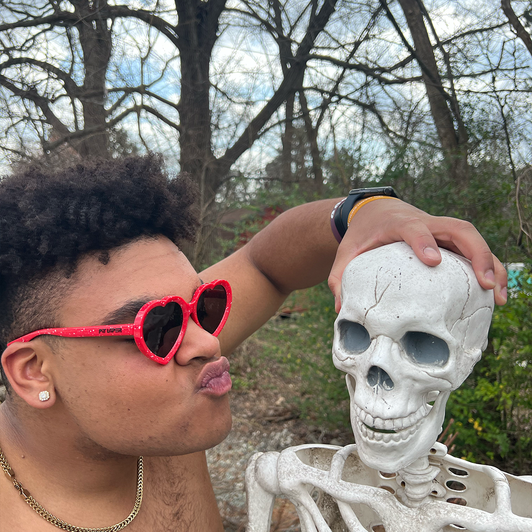 man wearing the responder admirers holding fake skeleton - lifestyle